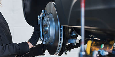 Mechanic working on brakes