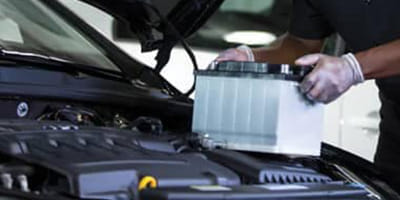 Mechanic working on battery