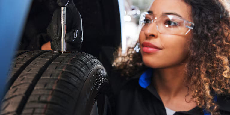 Woman changing a tire