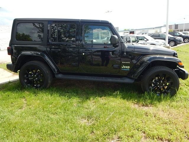 Used 2022 Jeep Wrangler Unlimited Sahara 4XE with VIN 1C4JJXP63NW147258 for sale in Kansas City