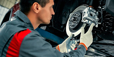 Mechanic working on brakes