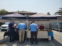 employees choose tacos at a food truck