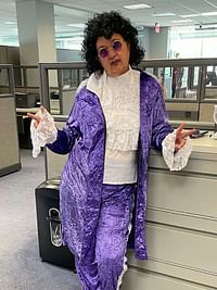 man in purple 80s outfit