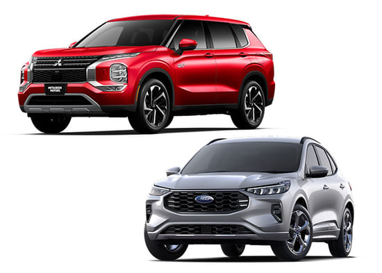 A red Mitsubishi Outlander PHEV with a silver Ford Escape on a white background.