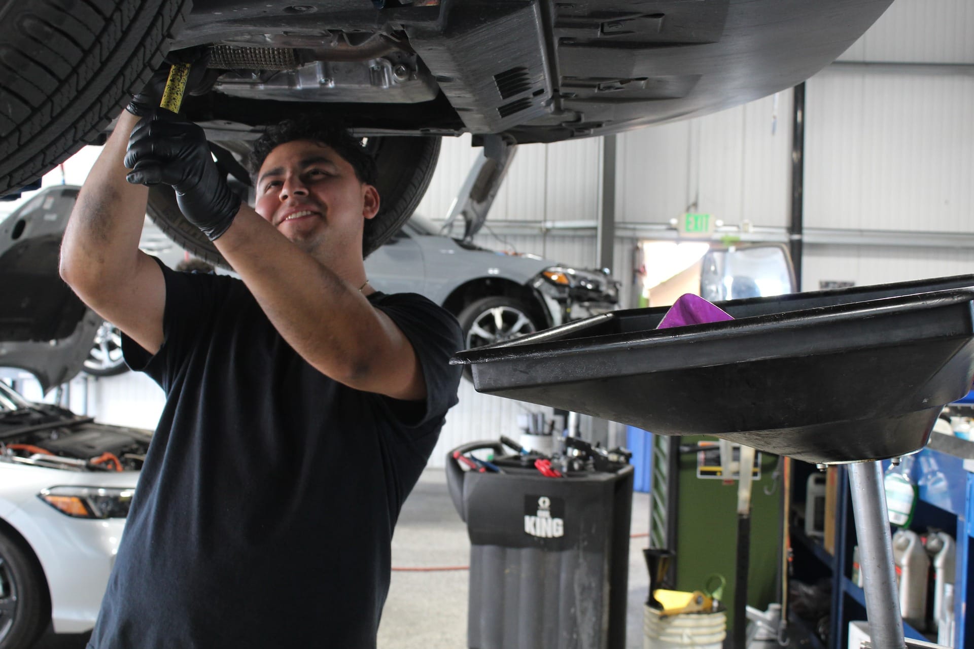 A mechanic working on a car