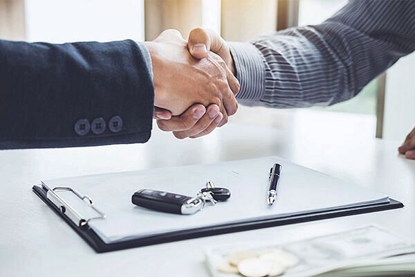 Handshake of cooperation customer and salesman after agreement
