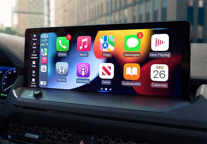 The 7-inch central touchscreen display of the 2025 Honda Accord LX showing Apple CarPlay or Android Auto interface.