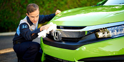 Detailer cleaning the car