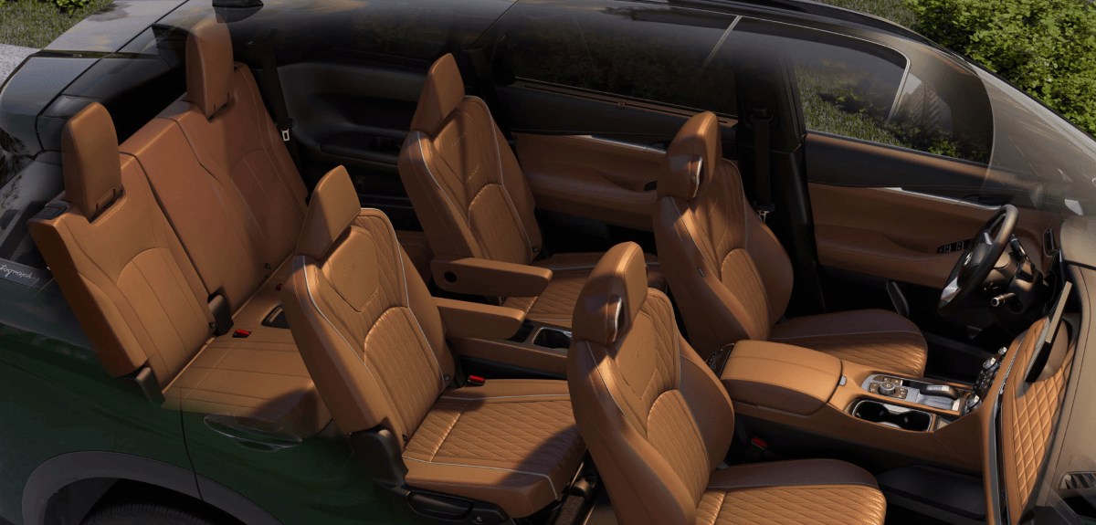 Spacious three-row seating cabin of the 2026 INFINITI QX60, demonstrating room for five to seven passengers.
