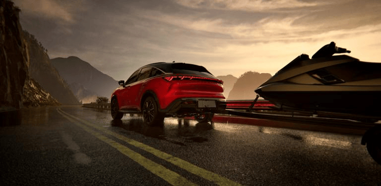 Rear exterior view of 2027 INFINITI QX65 towing a luxurious jet ski while driving on a bridge