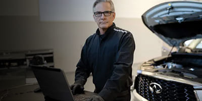 Mechanic looking at the computer