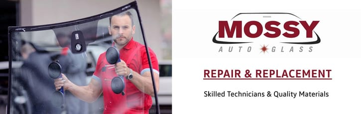 A technician in a red shirt uses suction cups to handle a windshield. Beside it, 'Mossy Auto Glass' logo with 'Repair & Replacement' text indicates services.