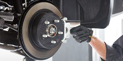 Mechanic working on brakes