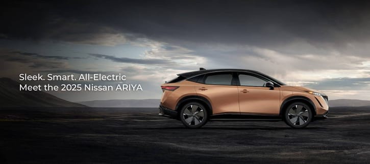 Sleek electric Nissan Ariya parked on a vast, open landscape under a dramatic cloudy sky. Text reads: "Sleek. Smart. All-Electric. Meet the 2025 Nissan ARIYA."