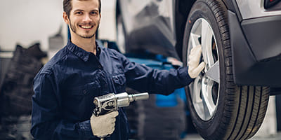 Mechanic working on tire rotation