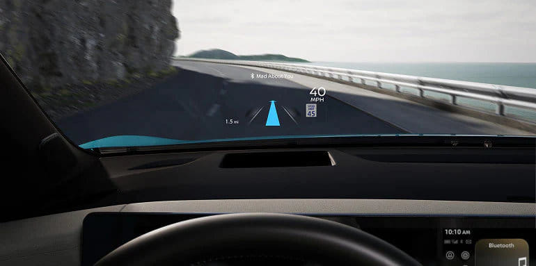 The Head-Up Display projecting vital driving information onto the windshield of the 2026 Nissan Leaf.