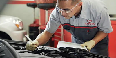 Mechanic performing multi point insepction