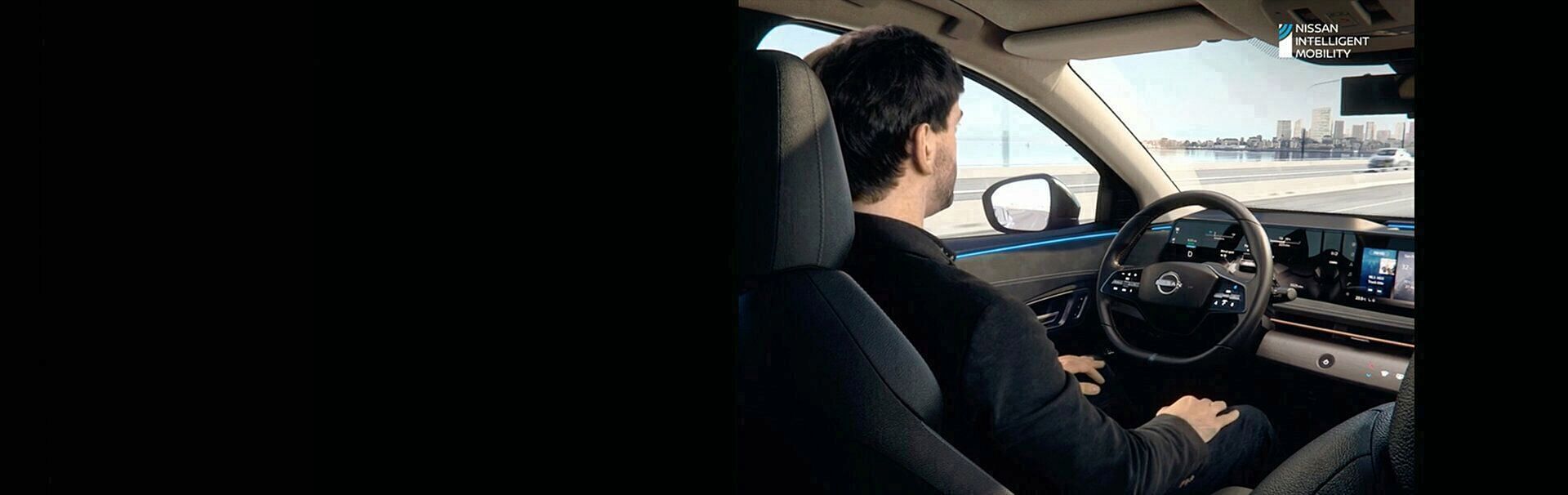 Man sitting in the drivers seat of a Nissan Ariya