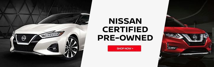 The front part of a white Nissan Maxima and a red Nissan Kicks - NISSAN CERTIFIED PRE-OWNED