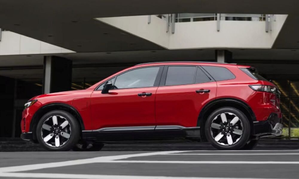 red honda prologue standing in city praking