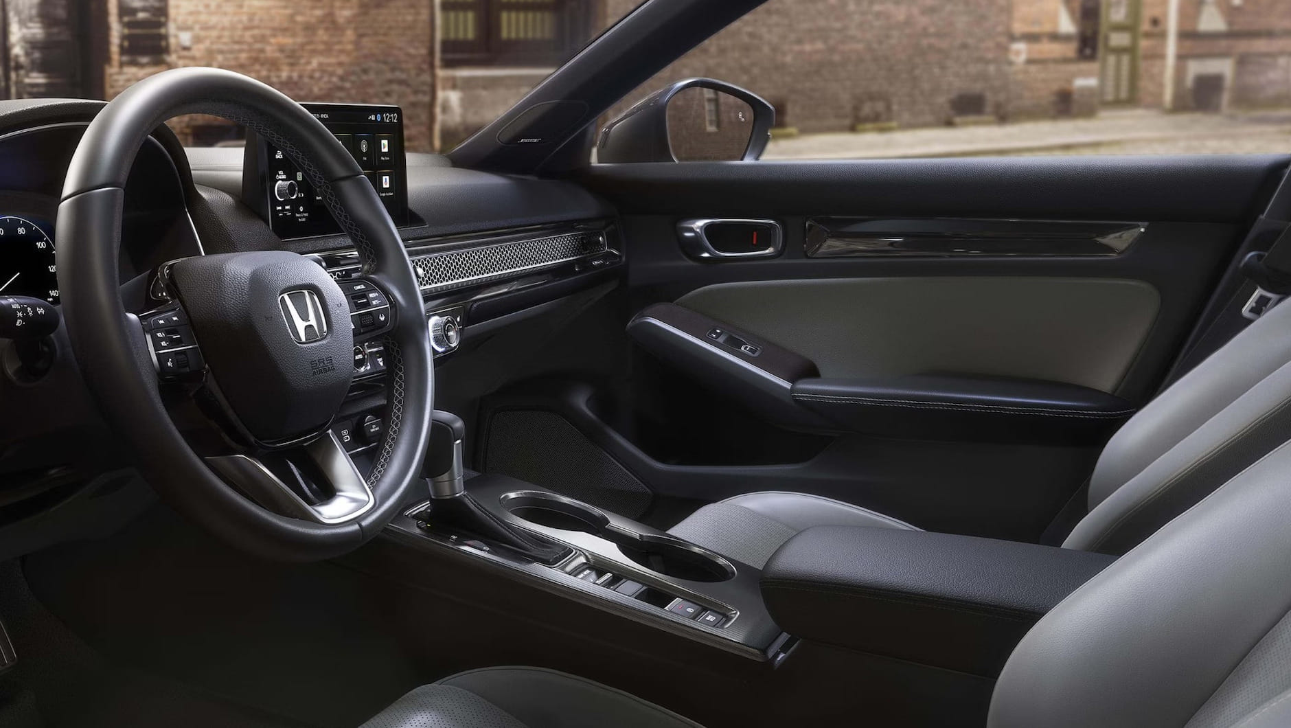 Interior of a 2026 Honda Civic Hatchback Hybrid with a sleek design. Features include a Honda logo on the steering wheel, digital dashboard, touchscreen display, and leather seats. The ambiance is sophisticated, conveying comfort and technology.
