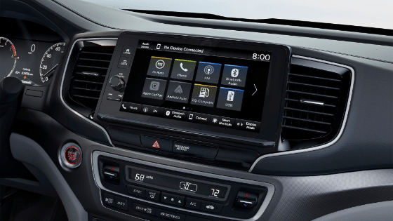 2026 Honda Ridgeline Black Edition with black and red interior, showing the dash and 9 inch display audio touch screen.