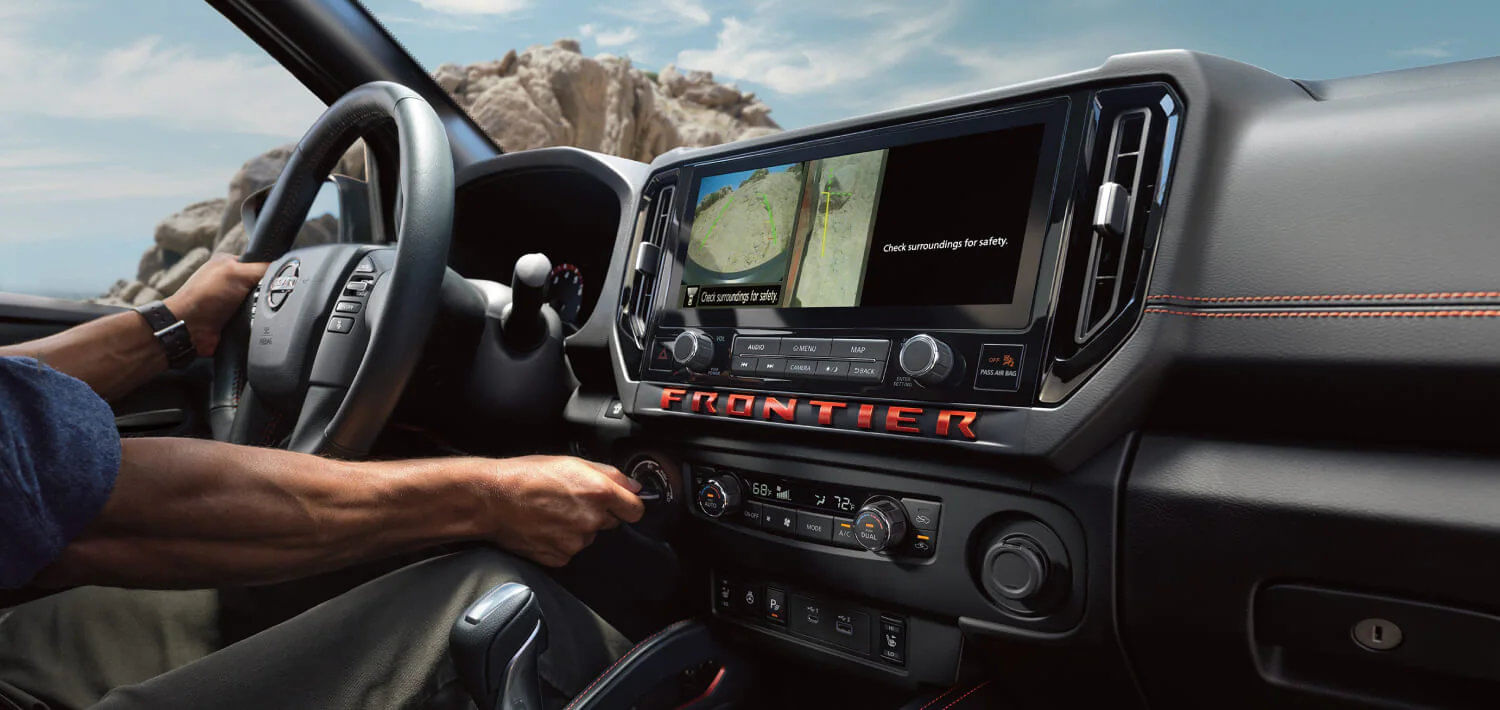 The Intelligent Around View Monitor on the 2026 Frontier's display, showing a virtual 360° bird's-eye view of the truck's surroundings.