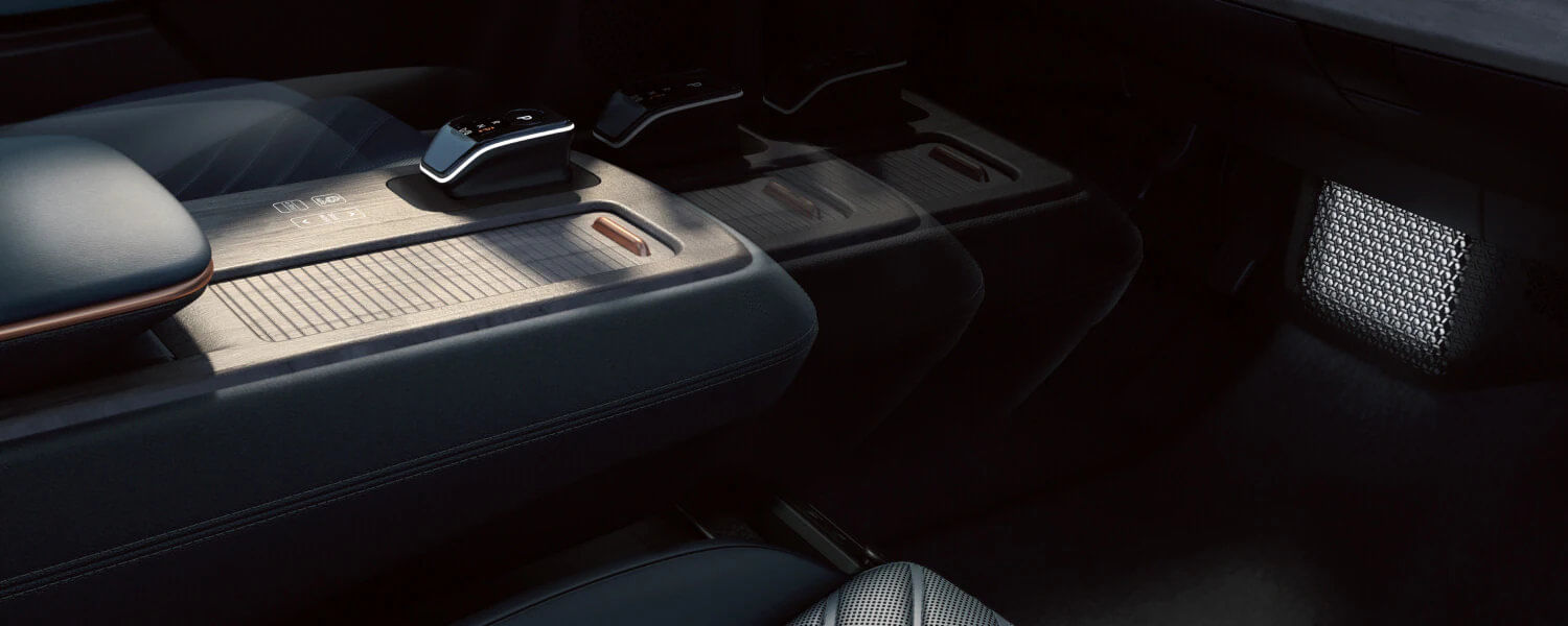 The 2025 Nissan ARIYA’s power-sliding center console offering versatile comfort and modern design.