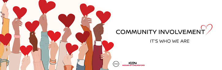 An illustration of diverse hands holding up red hearts with the text "Community Involvement. It's who we are." and the Icon Nissan of Chelmsford logo.