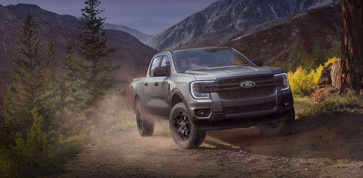 2025 Ford Ranger driving up a mountain trail.