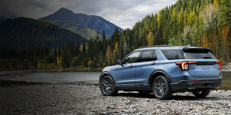 2025 Ford Explorer parked overlooking a lake in the mountain area.