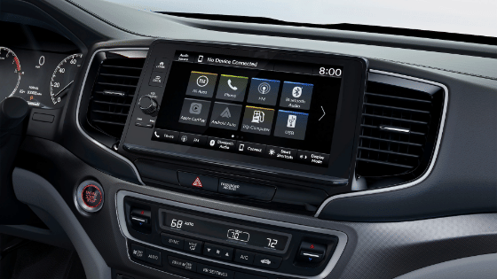 2026 Honda Ridgeline Black Edition with black and red interior, showing the dash and 9 inch display audio touch screen.