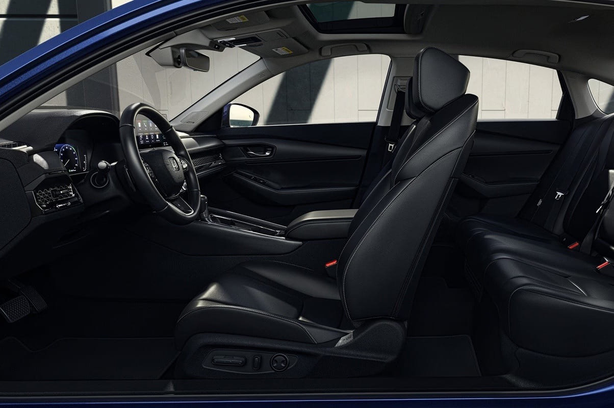 2026 Honda Accord Hybrid interior showcasing sleek black leather seats, a modern dashboard, and a sunroof. The design conveys a sense of elegance and comfort.