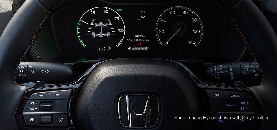 Driver information interface and steering wheel in 2023 Sport Touring Hybrid Honda with Gray lether interior