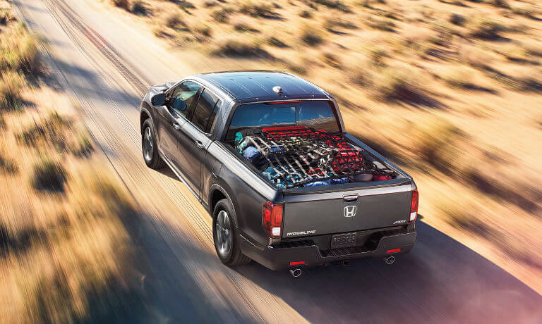 2025 Honda Ridgeline on desert road with cargo