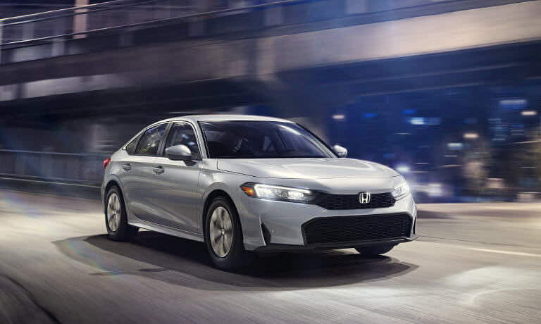 2025 Honda Civic Sedan driving on underpass at night