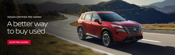 Nissan Certified - Red SUV with Mountains in the background