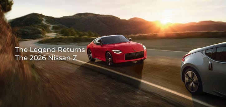 A vibrant red 2026 Nissan Z driving on a winding mountain road at sunset, showcasing its dynamic handling and modern design.