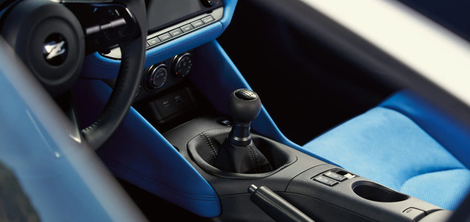 Interior view of the 2026 Nissan Z focusing on the available 6-speed manual transmission shifter.