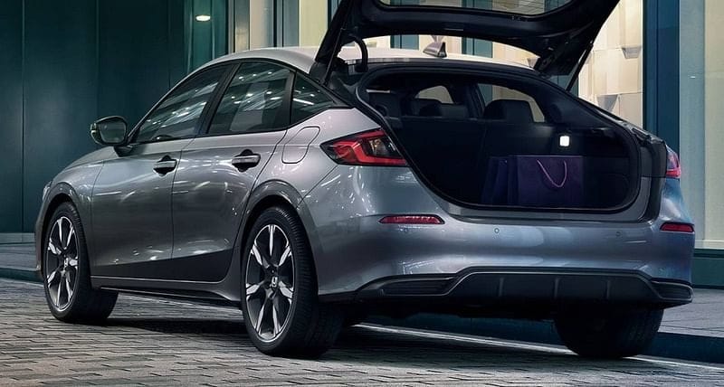 The 2025 Honda Civic Hatchback Sport Touring Hybrid in Solar Silver Metallic featuring cargo area