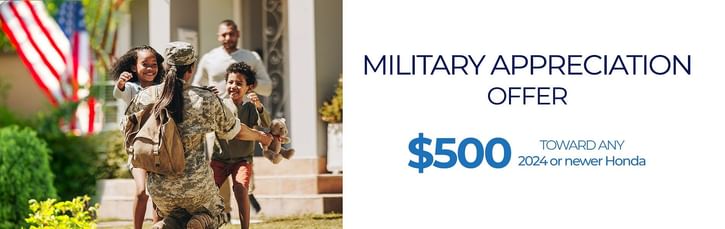 Woman in military uniform with a backpack returning home and embracing two joyful children, with an American flag in the background. Text on the right reads: 'Military Appreciation Offer – $500 toward any 2024 or newer Honda.'