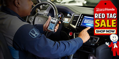 Mechanic inspecting vehicle