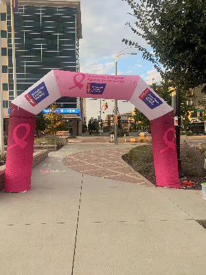 Pink inflatable archway for 'Making Strides Against Breast Cancer.'