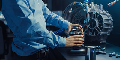 Mechanic pouring fluid