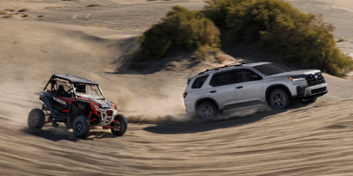 2026 Honda Pilot TrailSport shown in Solar Silver Metallic with Honda Genuine Accessories