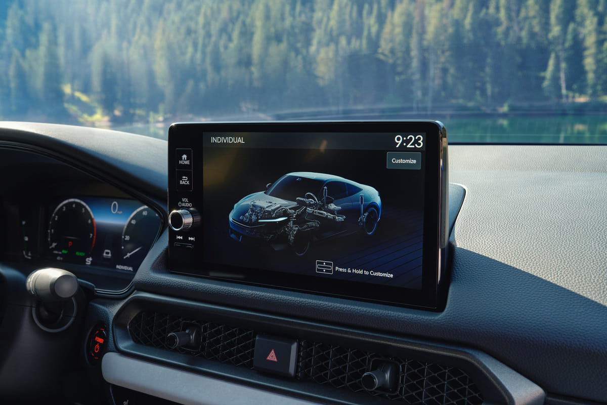The central infotainment screen of the 2026 Honda Prelude, displaying the customizable Individual drive mode with a detailed graphic of the car's hybrid powertrain and chassis.