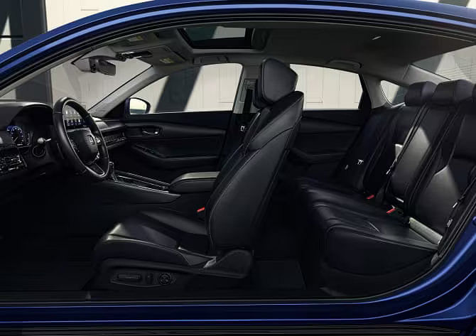 View of the spacious rear seating area in the 2025 Honda Accord, highlighting passenger comfort and available split-folding seats.