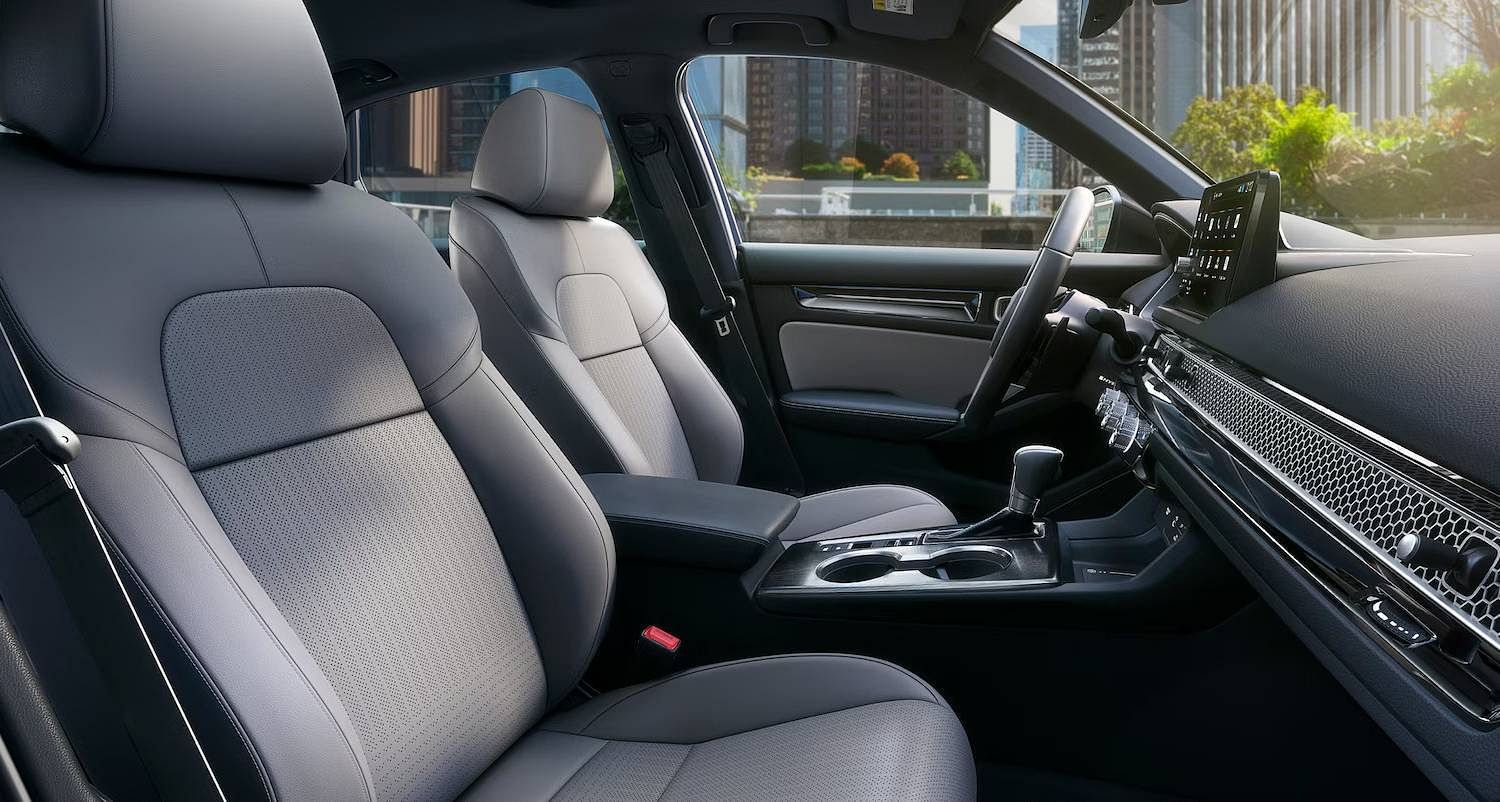 The 2025 Honda Civic Sedan Sport Touring Hybrid in Blue Lagoon Pearl, Grey Interior showing heated seats