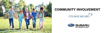 On the left children holding hands, on the right black text COMMUNITY INVOLVEMENT IT'S WHO WE ARE below logo Subaru Of North Bay on the white background