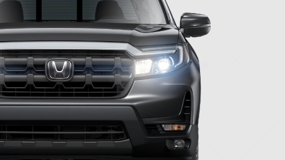 2026 Honda Ridgeline RTL in Modern Steel Metallic, headlight detail.